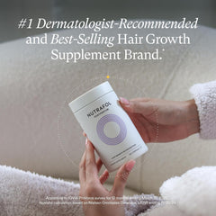 Nutrafol Postpartum hair growth nutraceutical bottle on white background