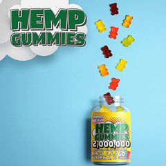 An Addot Welllife Hemp Vitamin bottle by supplementcorner spills colorful gummies onto a blue background. The label highlights 60 vegan gummies, omega fatty acids, and vitamins A and B. Large text reads HEMP GUMMIES with a cartoon cloud design—a perfect supplement for your daily relaxation boost.