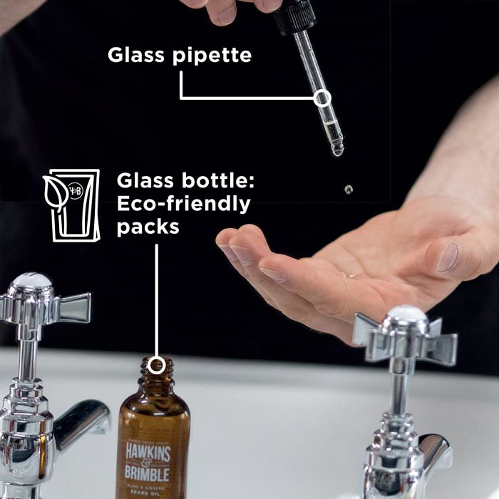 Man applying Hawkins & Brimble Elemi & Ginseng Beard Oil for soft, healthy beard and skin