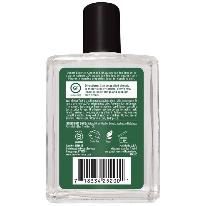 "Desert Essence Kinder to Skin Tea Tree Oil – clear bottle with green label and black cap"


