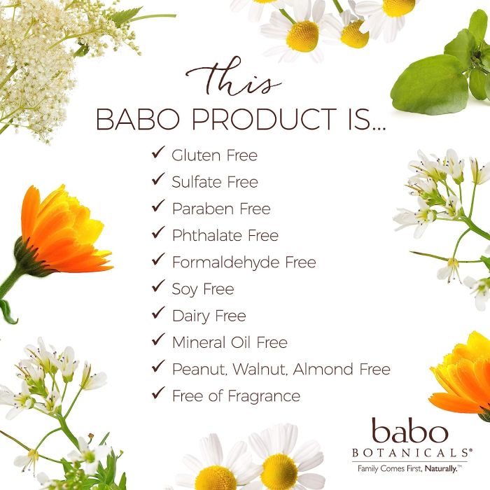 Babo Botanicals sunscreen lotion tube on sand, showing reef-safe vegan formula
