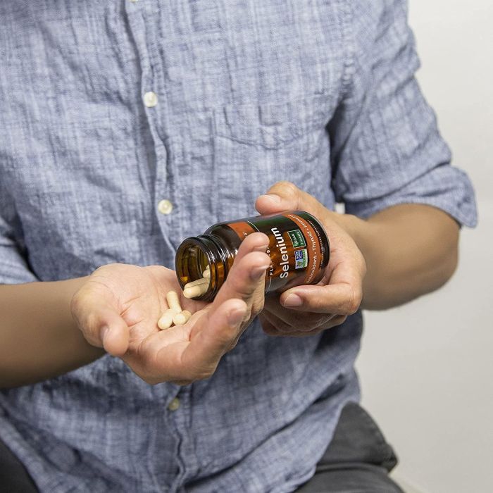 Open bottle of Global Healing Vegan Selenium – 60 vegan capsules for thyroid and antioxidant health