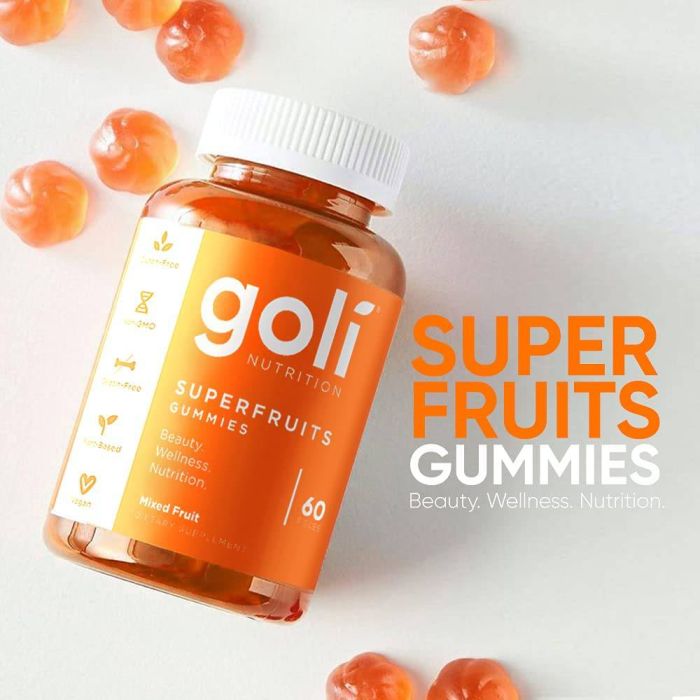 Goli Superfruits product with natural fruit background – supports skin and immunity