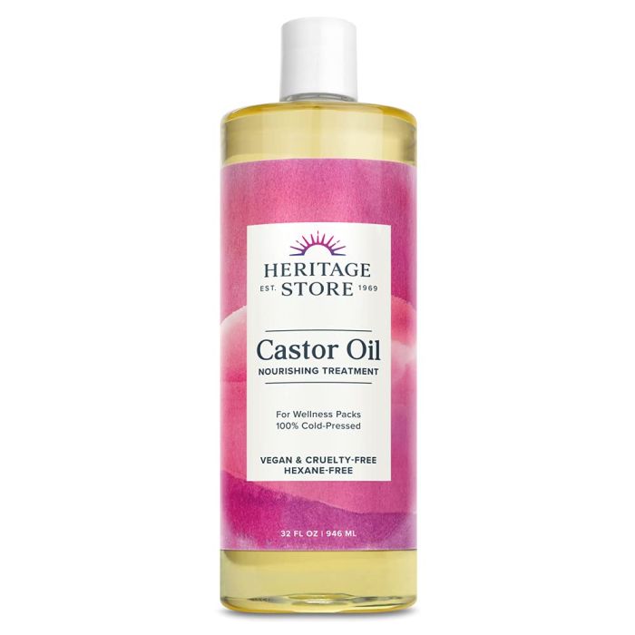 Applying castor oil to scalp – supports healthy hair growth