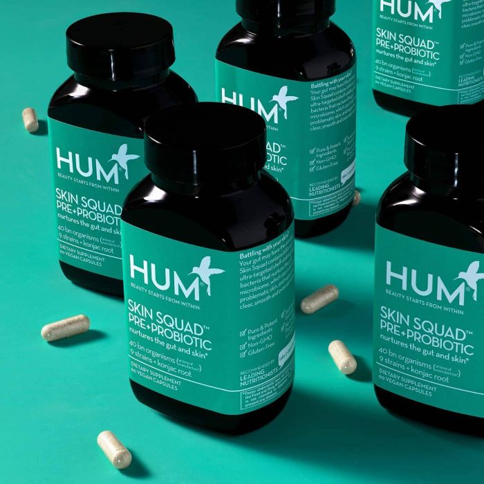 HUM Skin Squad capsules next to bottle – daily support for clear skin