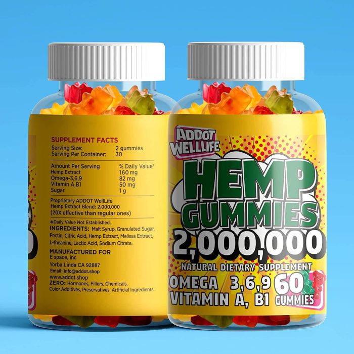 Two transparent bottles of supplementcorners Addot Welllife Hemp Vitamin 60 Vegan Gummies are set against a blue backdrop, revealing colorful gummies with 2,000,000 hemp extract, Omega Fatty Acids 3, 6, 9, and vitamins A and B1—a perfect vegan supplement for relaxation.
