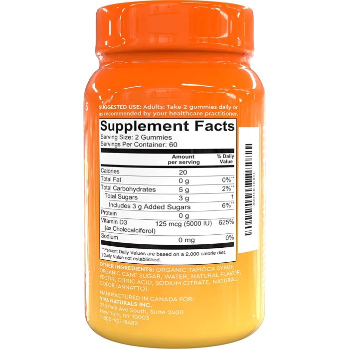 Two fruit-flavored gummies placed next to the Viva Naturals bottle